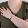 Sterling silver and gold nature inspired orca bracelet by agnes seaweed wisden worn by model