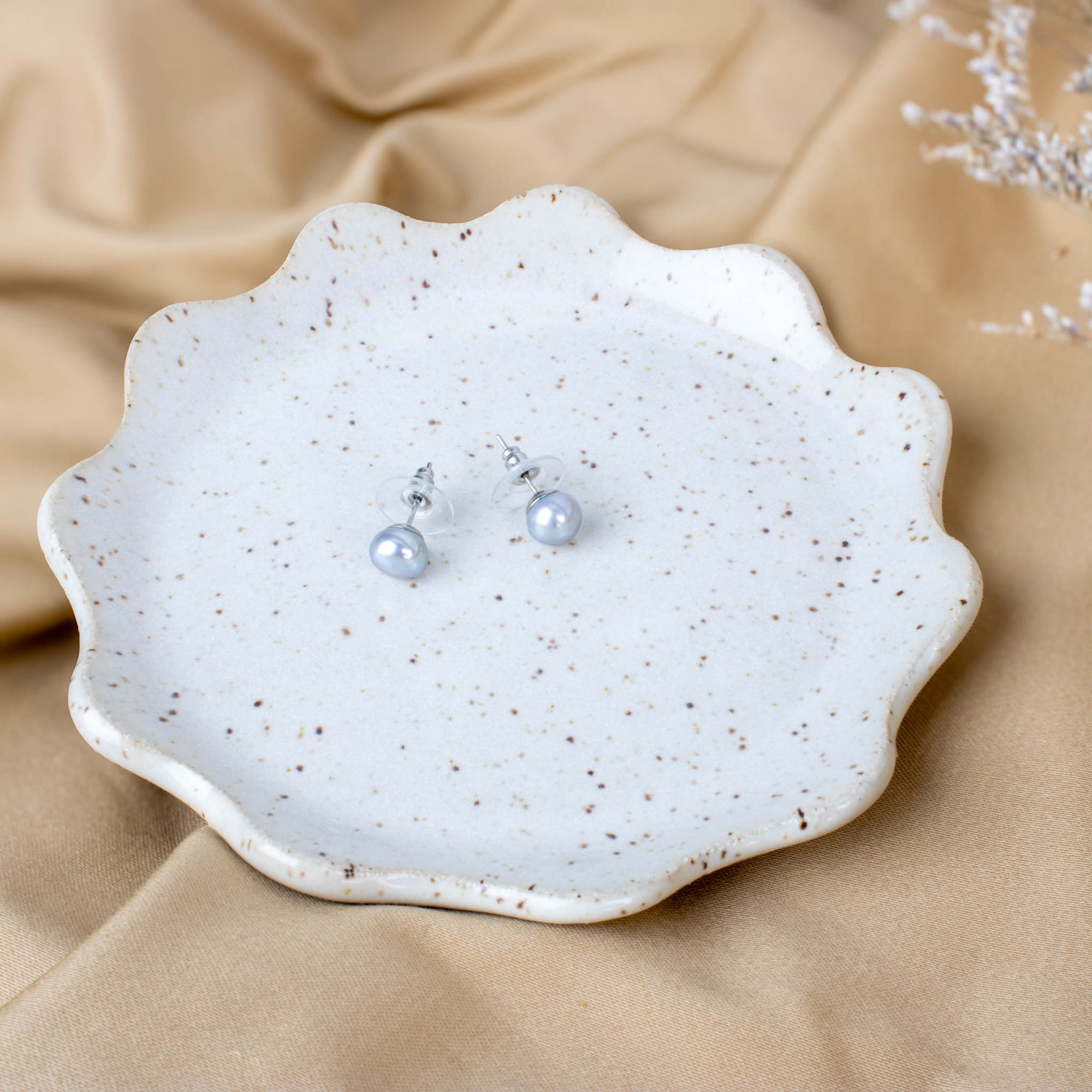 Delicate yet enduring, the Pearl is the perfect gem for June. A month of transition, lush growth, and quiet power. As nature unfolds in full bloom, Pearl reflects this energy: born of water, shaped by time, and glowing with serene beauty. It symbolizes sincerity, emotional clarity, and personal transformation. Just as many of us begin new chapters in summer’s light. Whether you're honouring a milestone or seeking a deeper connection to your inner self, Pearl offers calm, strength, and a gentle reminder of y