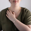Sterling silver and gold nature inspired raven bracelet by agnes seaweed wisden worn by model