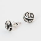 Pair of silver salmon Egg earrings on a white background by Native artist Meaghan McRae