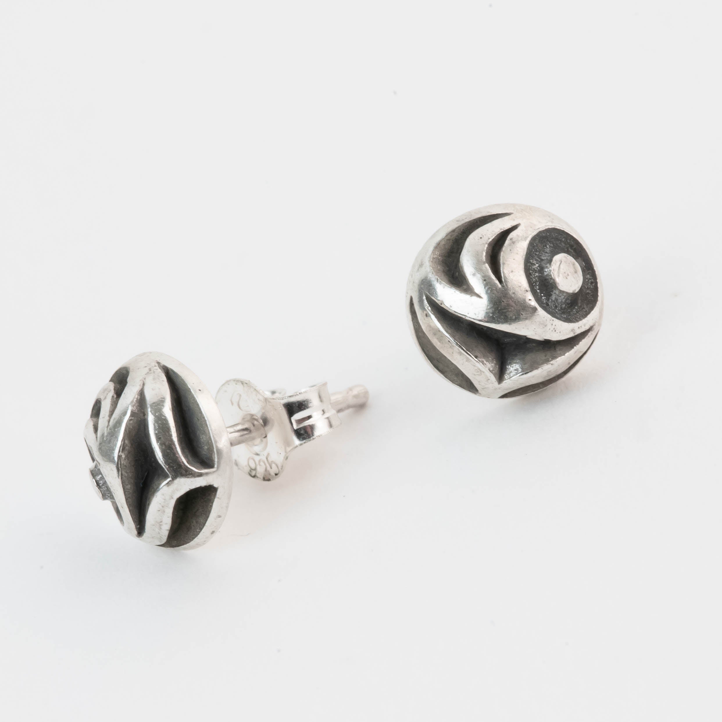 Pair of silver salmon Egg earrings on a white background by Native artist Meaghan McRae