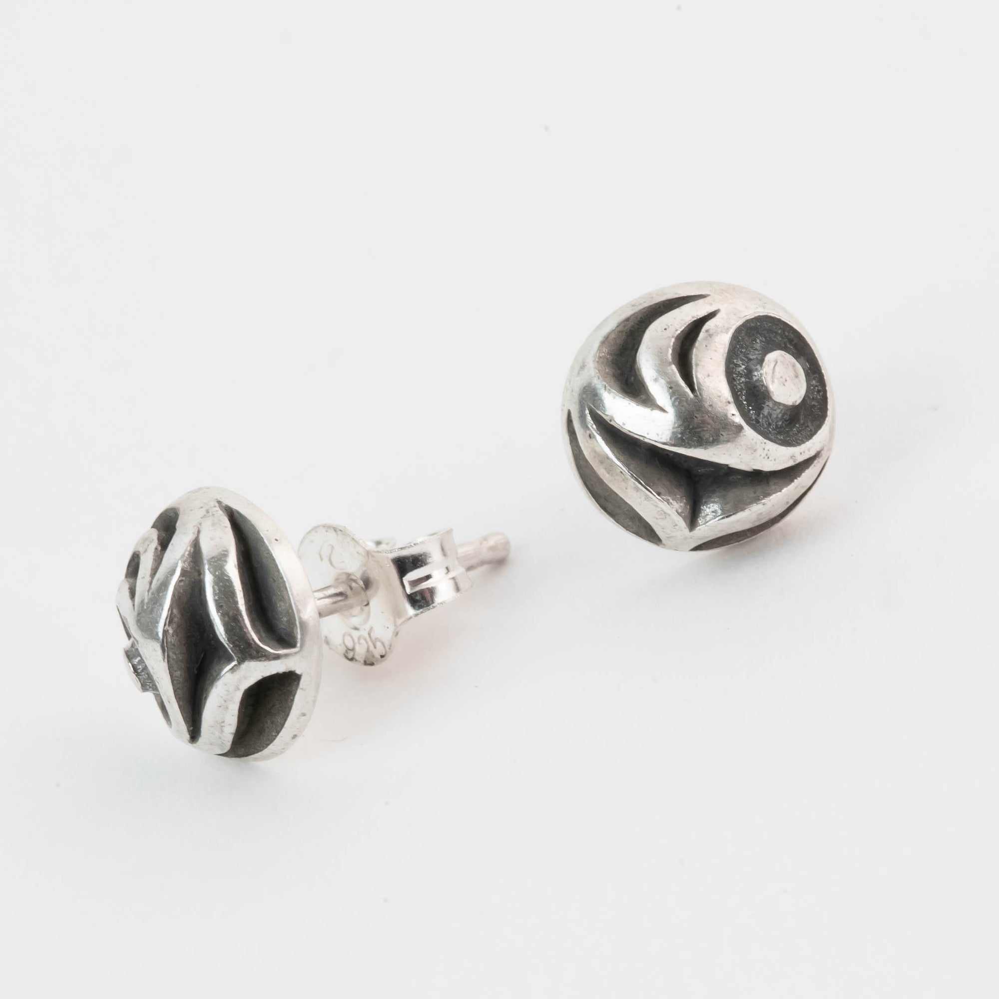 Pair of silver salmon Egg earrings on a white background by Native artist Meaghan McRae