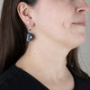 Argillite Salmon Egg earrings with  abalone inlay, and Shepard hooks with small black bead
