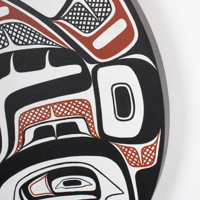 Sea Grizzly panel by Local Haida Gwaii artist Shoshannah Green hand painted on wood. In traditional black red and white. Showing corner of the panel to show its thickness