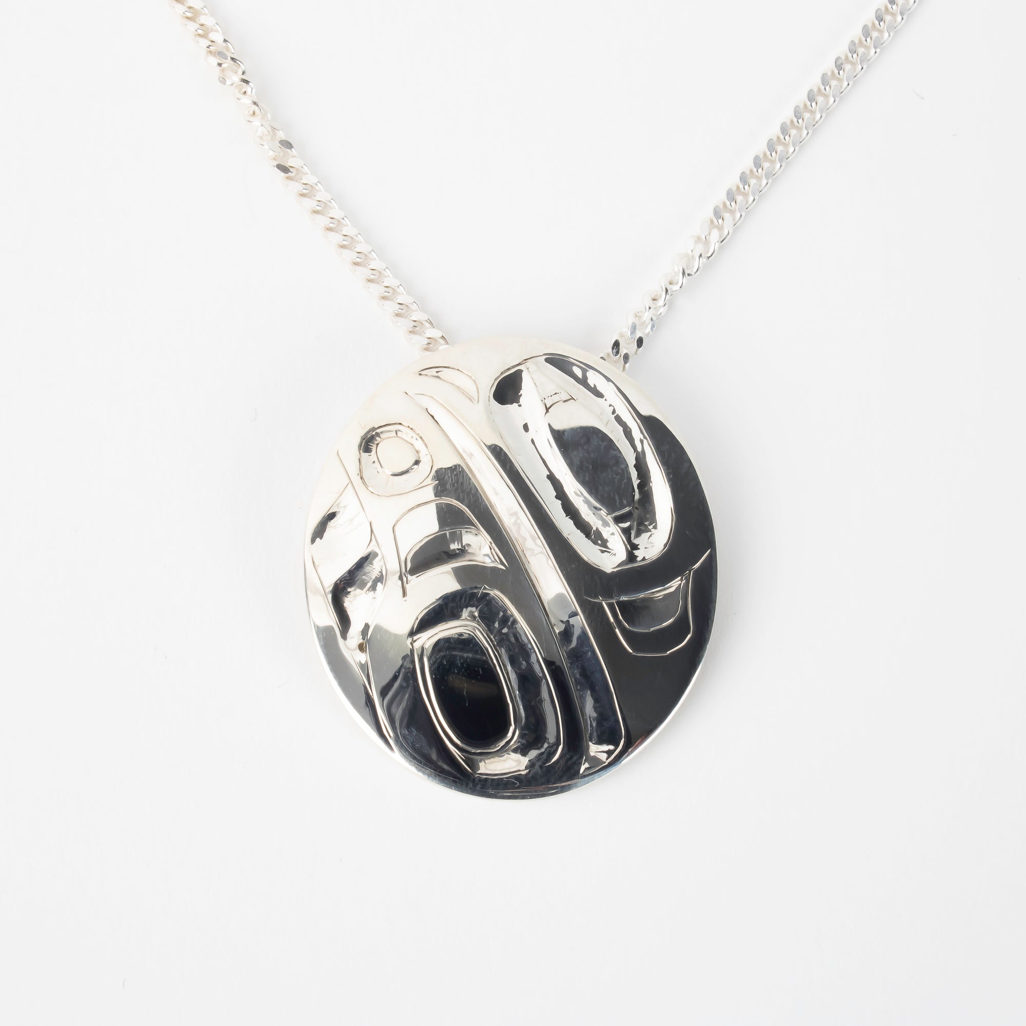 Haida Carver and Jeweller Alvin Adkins Sterling Silver Raven Pendant