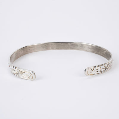 Back view of Sterling Silver Bracelet with flowers and a 14k gold hummingbird formline head made by first nations artist Agnes Seaweed Wisden