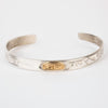 Sterling silver Bracelet featuring  14k gold formline orca head, with mountains, ocean and trees hand carved around the bracelet