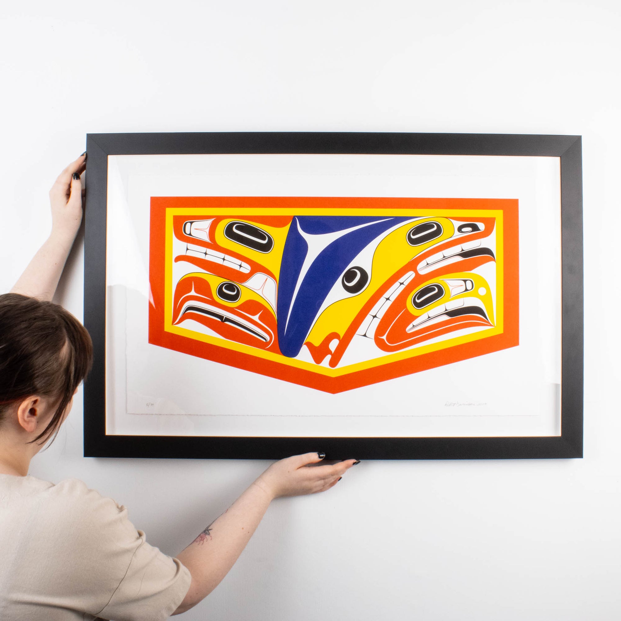 Photo showcasing the size ration with person in front holding the edges of the wood frame