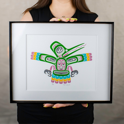 Model holding hummingbird art print for size ratio