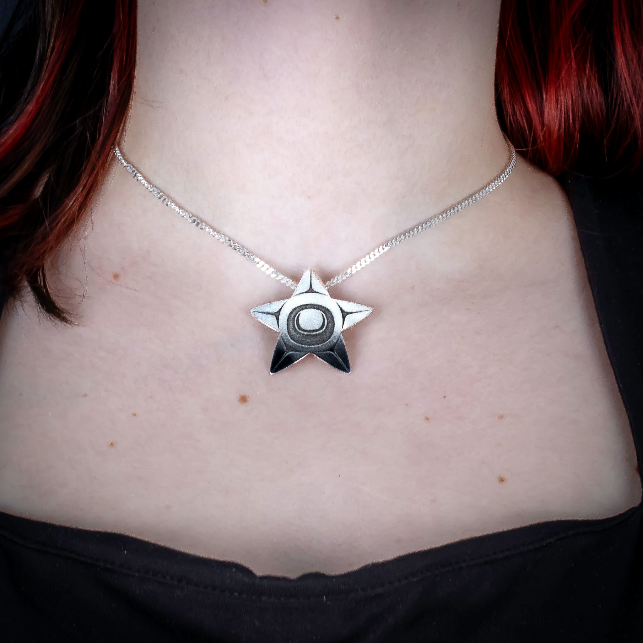 Sterling Silver Starfish Pendant by Canadian Handpoke tattoo artist Danika worn by a model
