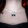 Sterling Silver Starfish Pendant by Canadian Handpoke tattoo artist Danika worn by a model
