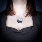Sterling Silver Salmon Egg Pendant by Canadian Handpoke tattoo artist Danika worn by a model