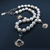 Freshwater Pearl Necklace with Sterling Silver Clamshells & Salmon Bone Vertebrae by Morgan Asoyuf (Ts'msyen)