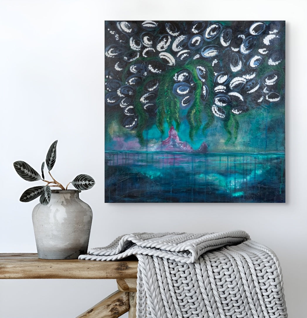 Abstract painting on a wall above a wooden bench with a vase and blanket.