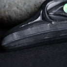 Close up of hand carving makrs on the argillite beak of the flicker.