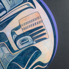 Close up of painted wood with blue hand holding orange basket.