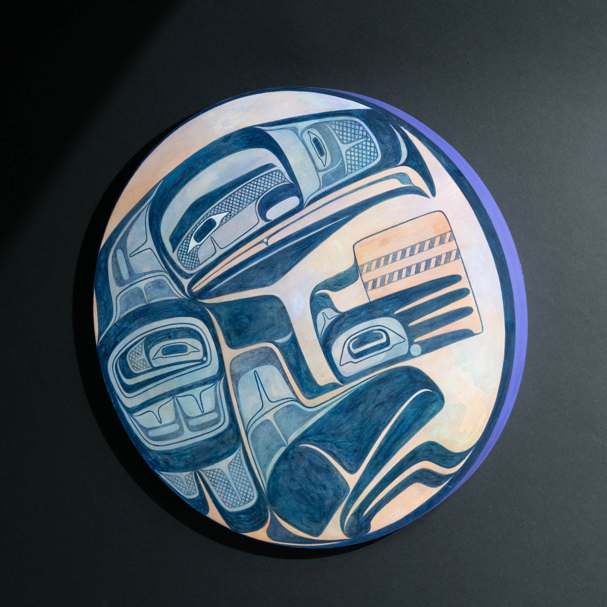 Round blue purple orange painted panel with figure holding a basket.