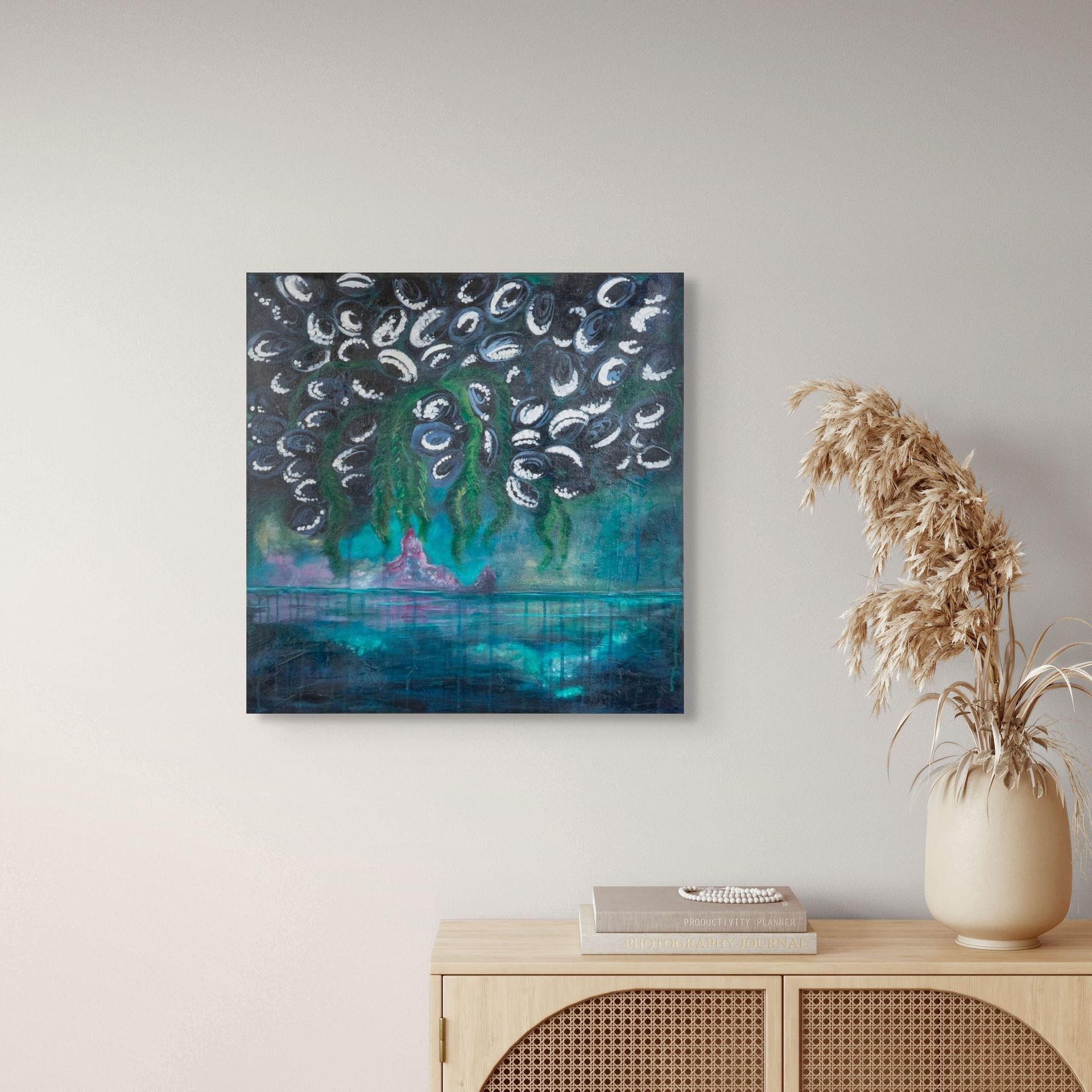 Blue, green, and purple original painting by Danielle Louise Allard in a beige office with cream coloured wall and desk.