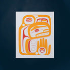 A rectangle Haida art print featuring a stylized Indigenous Northwest design in orange, red, and white, centred against a dark navy blue background.