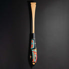 Haida formline paddle art by Alyson Bell showing the entire paddle on a black background. 