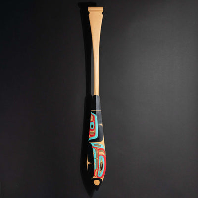 Haida formline paddle art by Alyson Bell showing the entire paddle on a black background.