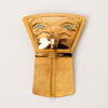 Gold pendant in the shape of a shield with an eagle design and blue eyes