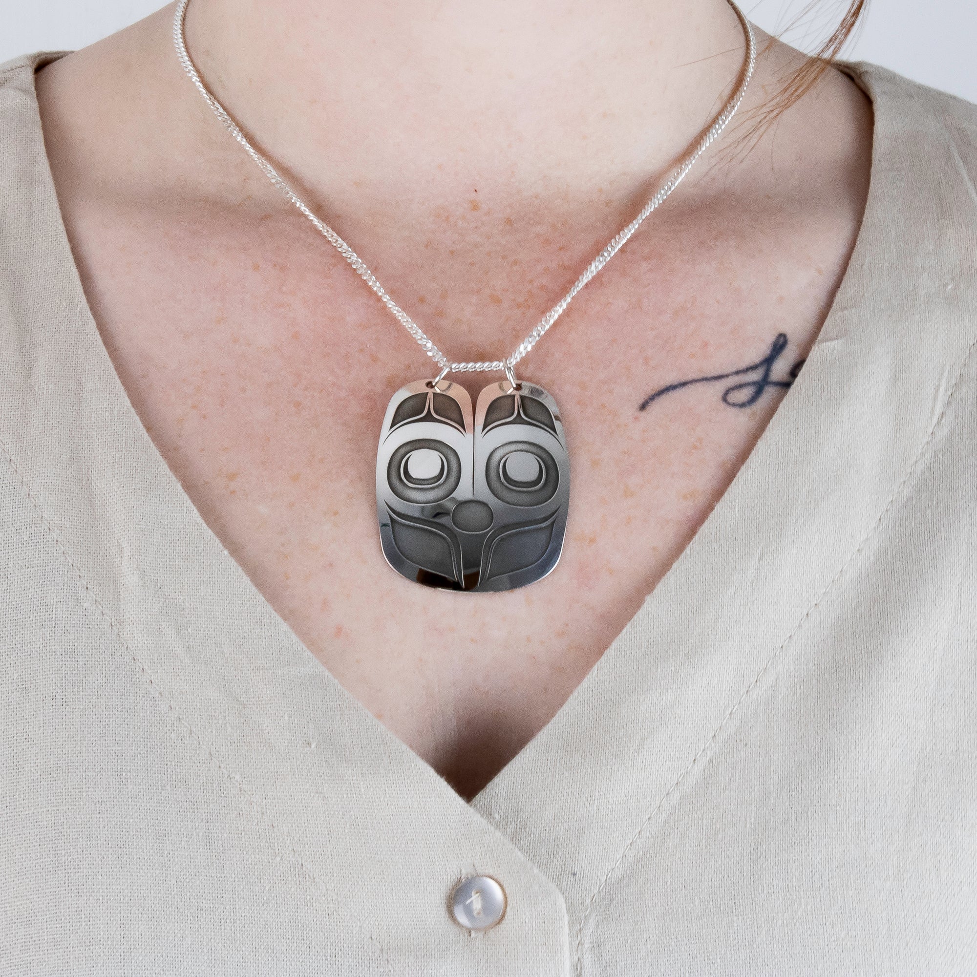 Sterling Silver Mouse Woman Pendant, by Danika Saunders Nuxalk artist and jeweller, worn by model