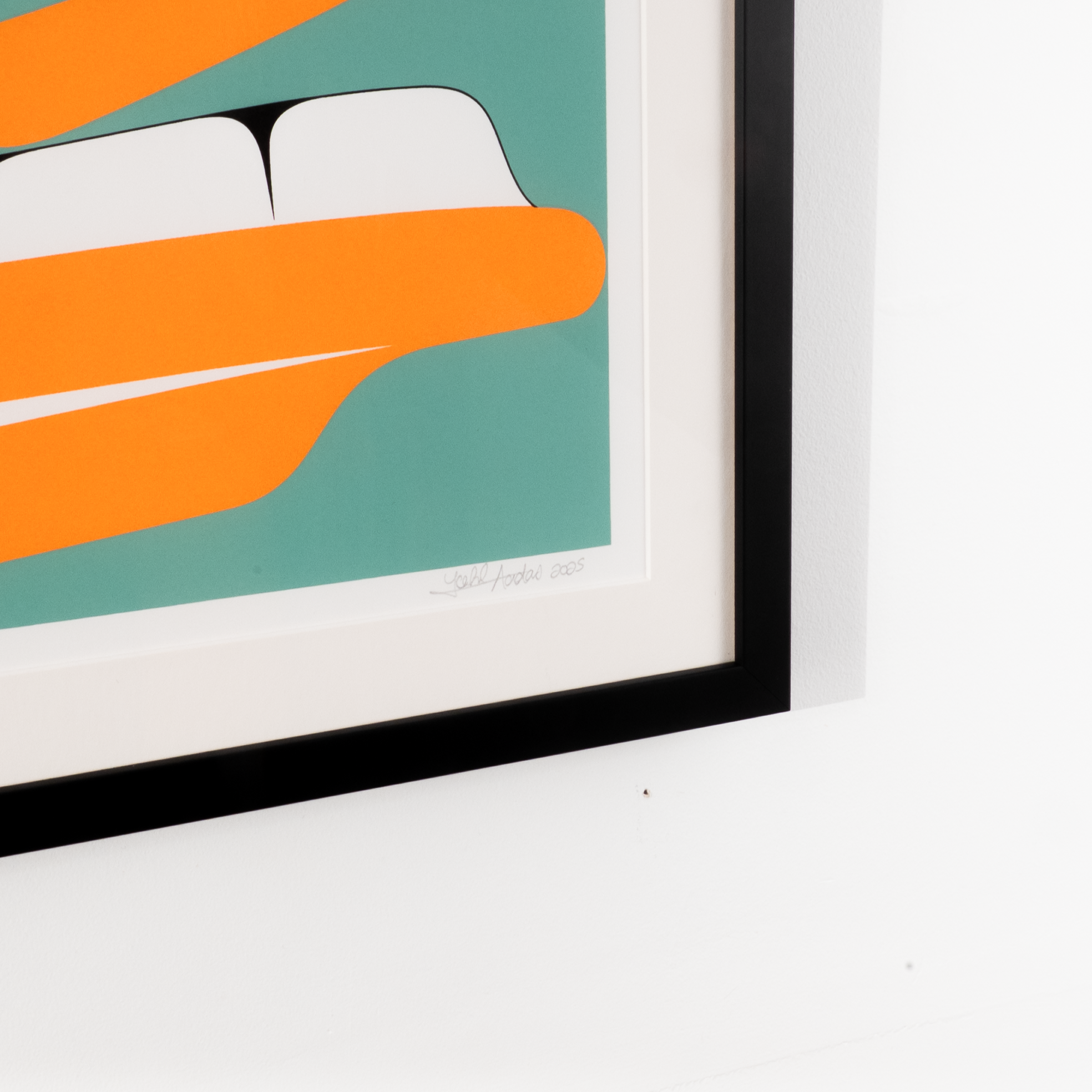 Framed artwork of a stylized Halibut face with orange, green, and black colors framed and ready to hang by Cori Savard