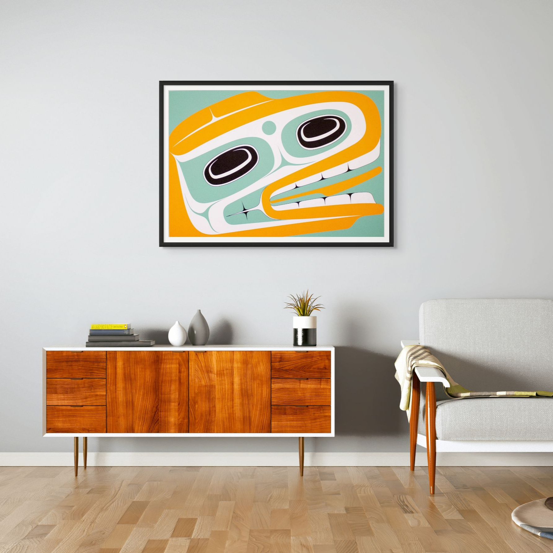 Modern living room with a wooden sideboard, abstract art on the wall, and a gray sofa.