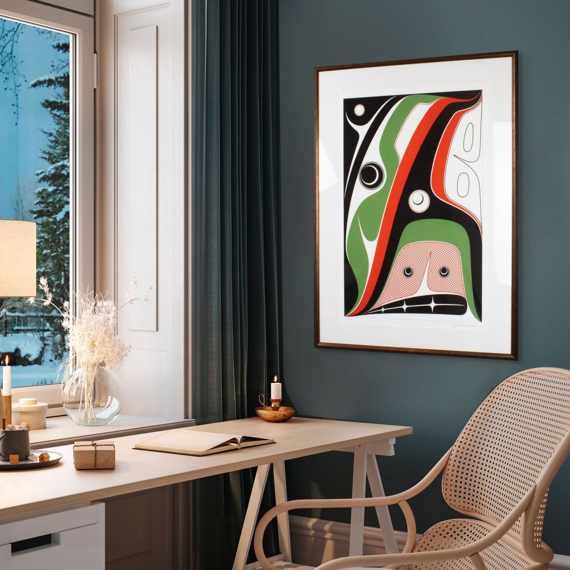 Hope print by Robert Davidson on the right side of a dark blue wall with a window of a wintry landscape.