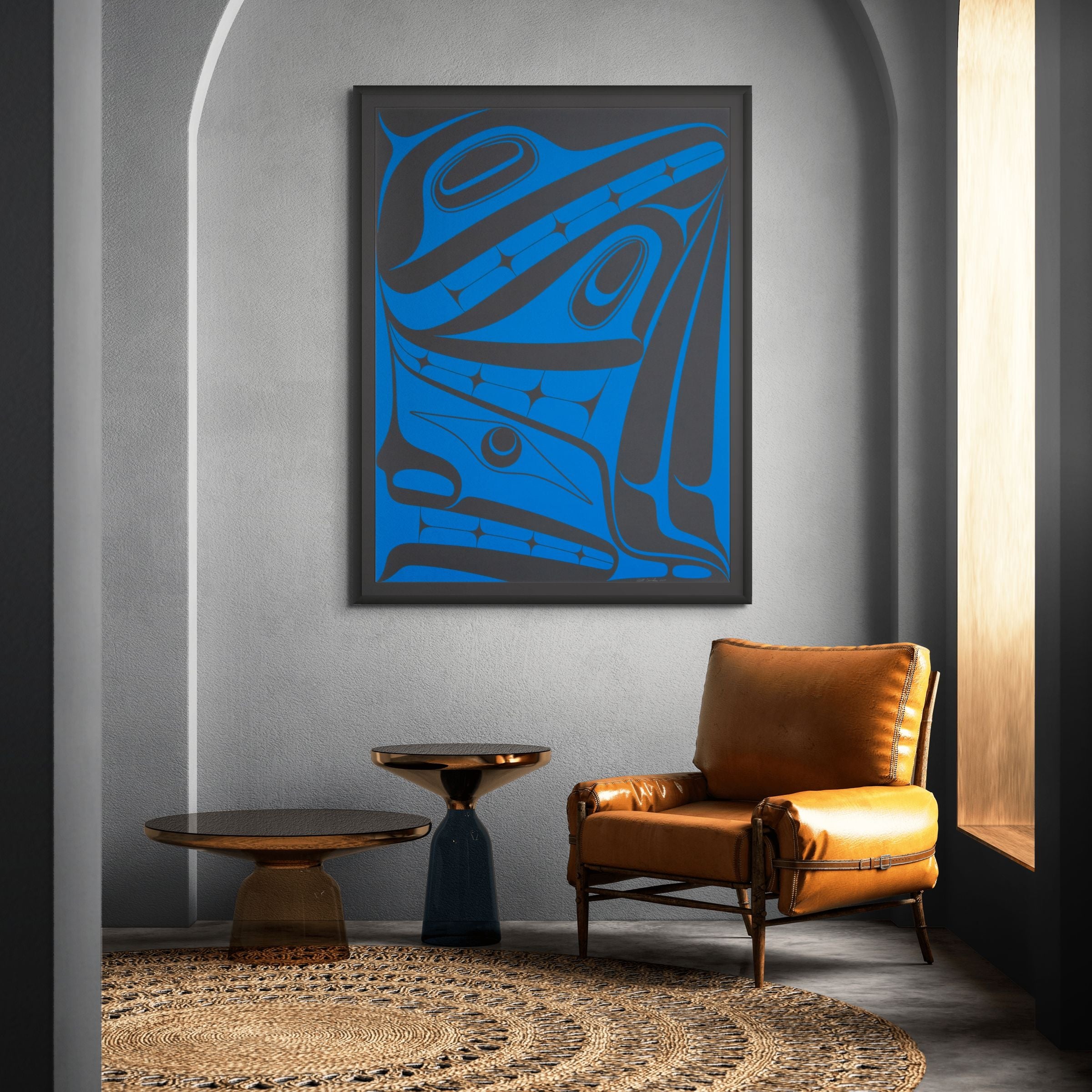 Modern interior with a blue abstract painting, brown leather chair, and round wooden table.
