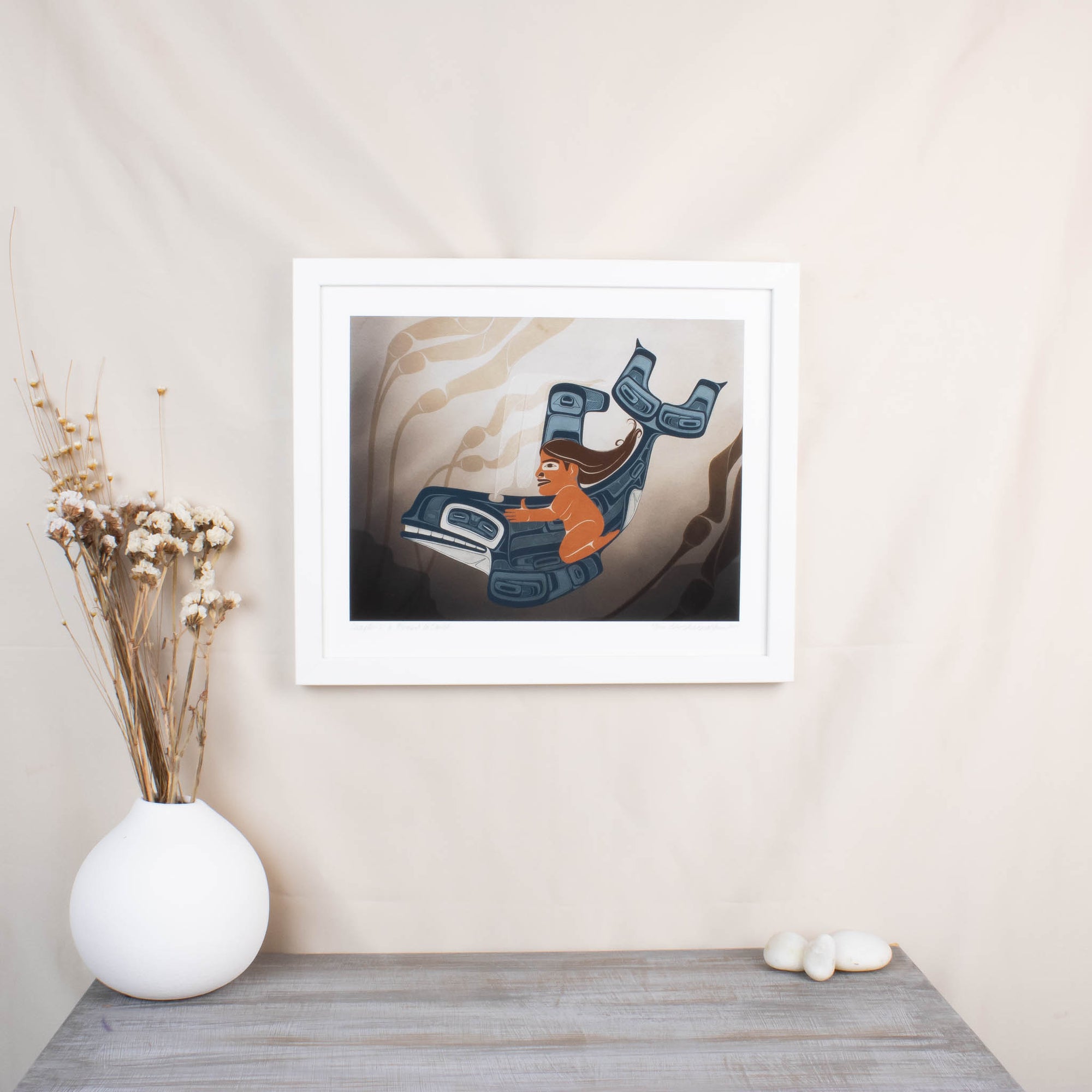 A moment to Vanish Chapter one. the first in a series and a gallery exclusive it features a women rinding through a kelp bed on an killer whale. In soft blues and browns: Framed in a white frame with conservation glass in a room set up