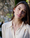 Model wearing Haida argillite feather earrings
