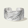 Men's 1.5 inch wide sterling silver raven bracelet by northwest coast Haida artist James Sawyer. Sold by Crystal Cabin Gallery on Haida Gwaii.