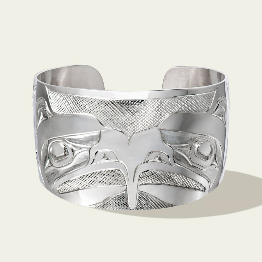 Wide sterling silver eagle bracelet by northwest coast Haida artist James Sawyer. Sold by Crystal Cabin Gallery on Haida Gwaii.