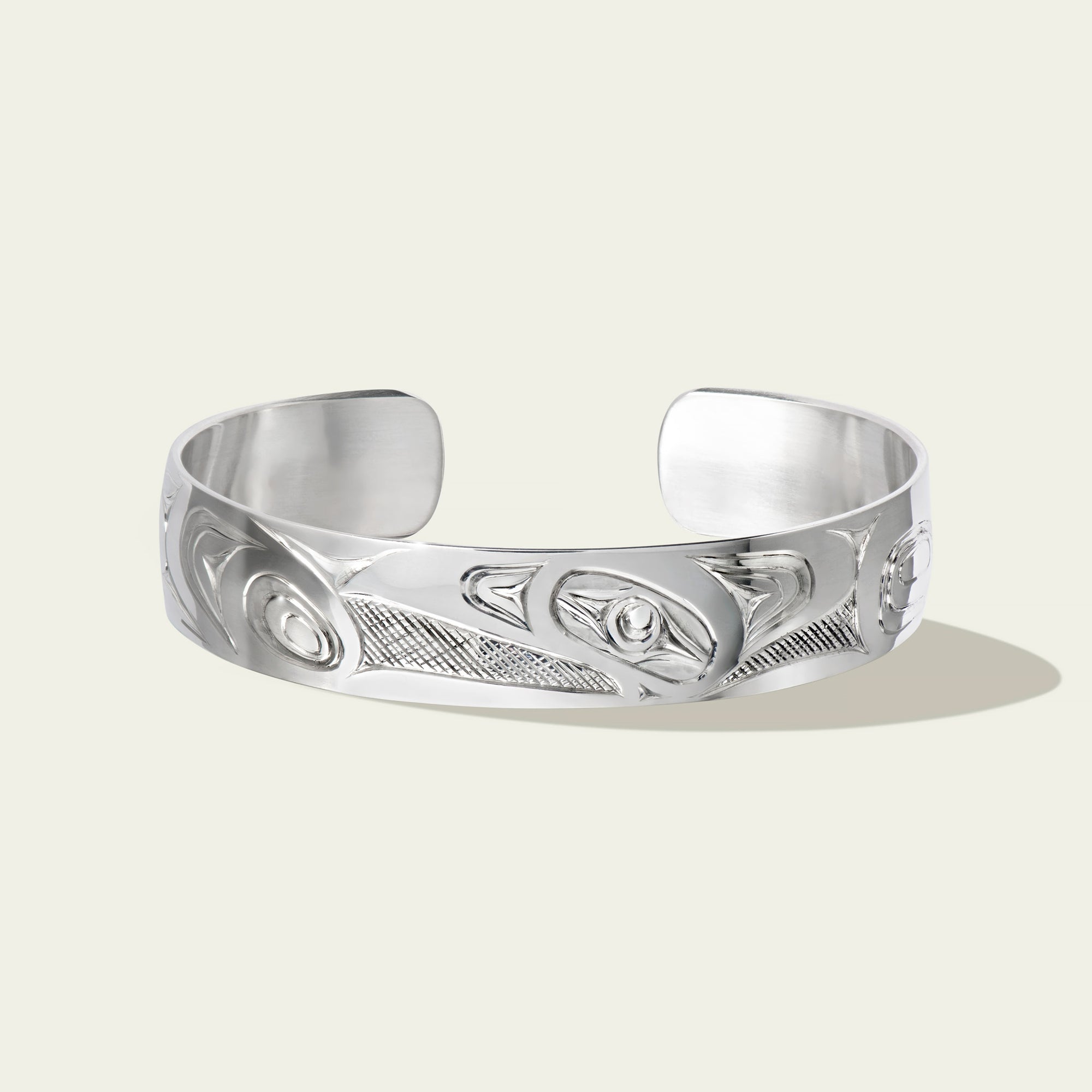 Sterling silver raven bracelet by northwest coast Haida artist James Sawyer. Sold by Crystal Cabin Gallery on Haida Gwaii.